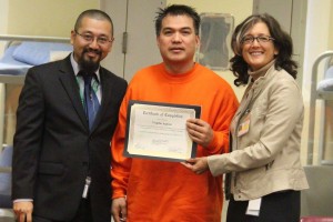 Virgilio receiving his certificate for completing his Kingian Nonviolence Training.